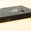 De bediening voor het on-screen menu bovenop het dock