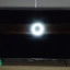 TCL antireflectie zonder CrystGlow: de weerkaatsing van de ringlight is veel groter en feller